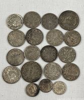 All nineteen coins laid out to show obverse designs
