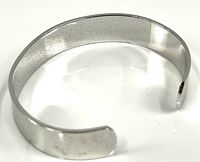 polished silver/stainless cuff bracelet showing open back and rounded ends