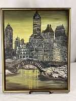 Full view of framed cityscape painting