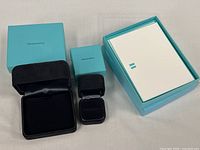 Open presentation boxes with stationery box and note cards visible