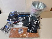 Overview of lot showing flight tray, jerseys, bucket and packaged bar mat
