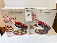 Front view of both original boxes for cupcake maker and donut maker