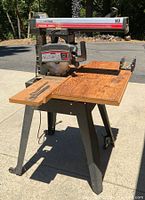Side view of Craftsman radial arm saw on stand