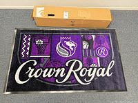 Full view of floor mat with original box showing overall design and size