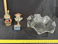 Group shot showing all four items with ruler for scale