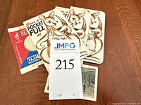 Group shot of dime saver booklets, medallion package, photo, and small cards