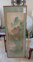 Front view of framed Chinese landscape painting