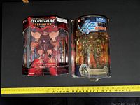 Front view of both sealed Gundam figures showing packaging and contents