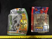 Front of both packaged figures showing contents