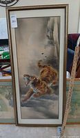 Front view of framed tiger painting showing subject, mat, and frame