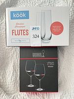 Front of boxes showing Riedel Vinum wine glasses and Kook stemless champagne flutes packaging