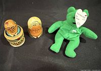 Nesting doll sections and Ty Erin bear displayed