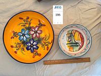 Top view of both bowls showing interior designs and relative size with ruler
