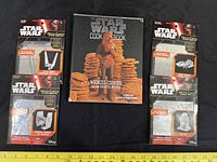 Front view of cookbook and four Metal Earth kits