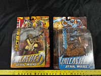 Front view of both sealed Star Wars Unleashed figures in packaging