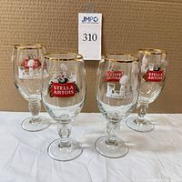 Four chalices showing both logo sides and gold rims