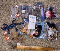 Group shot: three loose toys (koala, lizard, crab) beside six sealed Ty Teenie Beanies