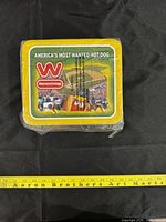 Front view showing Wienerschnitzel logo and “America’s Most Wanted Hot Dog” text