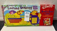 Front of boxed Disney Winnie the Pooh Learning Keyboard