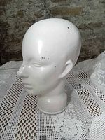 Front-left view showing facial features and paint chips