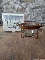 Chafing dish on stand beside original box