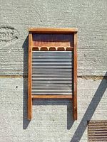 Front view showing corrugated metal surface and wood frame