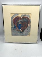 Full view of framed heart painting with mat and silver frame