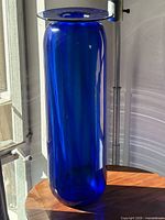 Full view of cobalt blue glass floor vase showing height and color