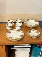 Full 16-piece set stacked on sideboard