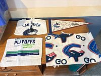 Group shot of all four Canucks items on table