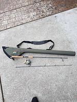 Rod, spare section, reel attached, green rod tube overview