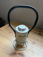 Full view of lantern showing handle and base