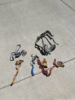 Full lot laid out showing harness, carabiners, belay devices, slings, cord and gloves