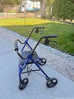 Full view of blue Elite rollator showing seat, handles, wheels