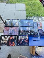 Overall view of all Highlander VHS sets and loose tapes on table