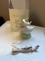 Mother Goose night light, power cord and original box displayed