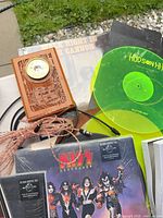 Close-up of sealed KISS LP, platter mat, gauge, cables
