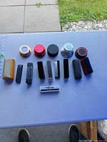 Group shot of all record weights and brushes on table