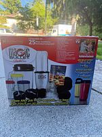 Front of Magic Bullet Deluxe box showing product image and accessory count