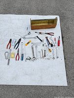 Overhead view of all tools laid out with toolbox