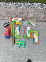 All 12 outdoor toys laid out on ground