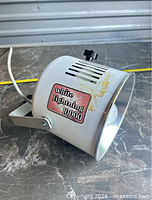 Side view showing White Lightning 10,000 badge, housing wear, power cord, yoke