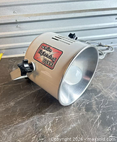 Side view showing White Lightning 10000 badge, mounting yoke and power cord