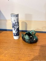 Overall view of vase and swan planter on tabletop