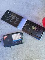 Both radios; Grundig G2 in box open, Zeon Tech alongside