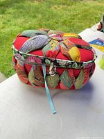 Closed quilted red multicolour sewing basket