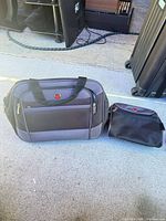 Carry-on bag and toiletry kit side by side