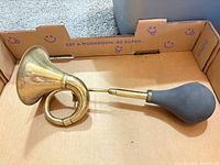 Full view of brass bicycle horn with rubber bulb