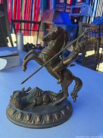 Front view of bronze St. George figurine on base