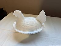 Assembled hen on nest dish side view